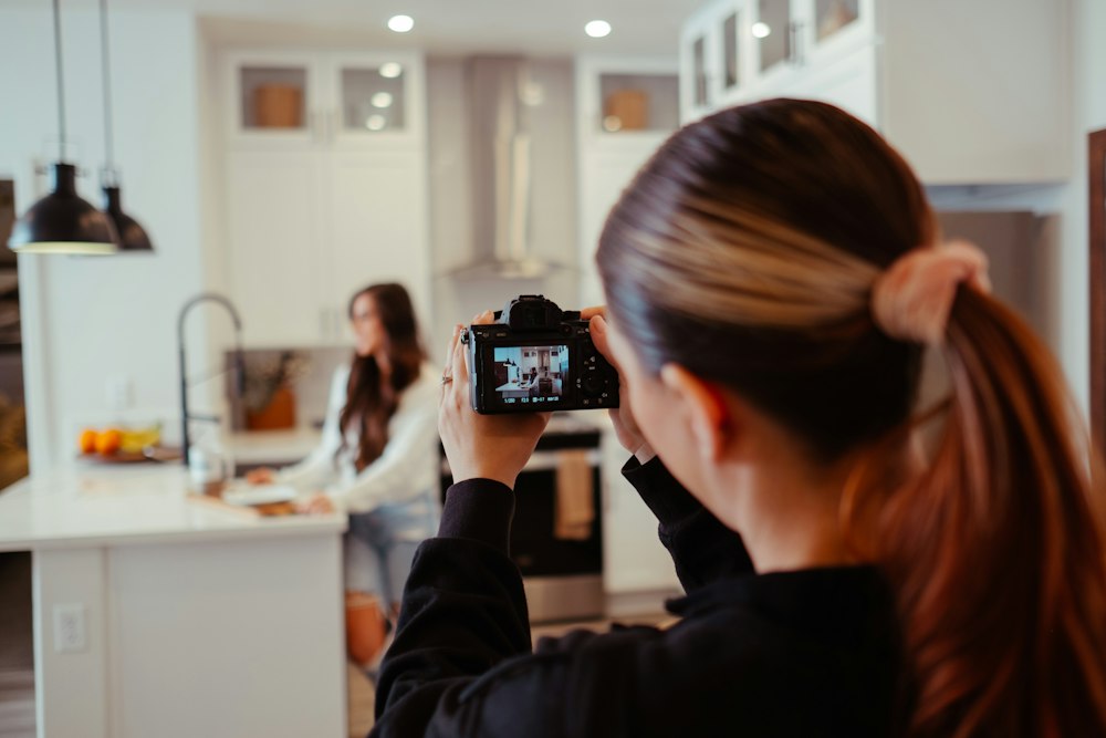 A creator filming a short video in a kitchen